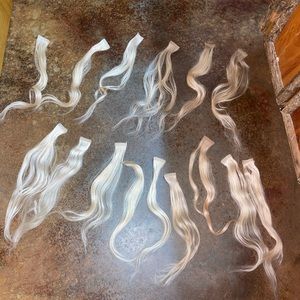 Real hair extensions NEW (washed once) I have 22.5 inch hand tied & tape ins